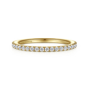 Gabriel & Co. WB14719E8Y44JJ 14 karat yellow gold Contemporary wedding band, front view of round diamonds filling the face of a straight band, with a maker's mark inside