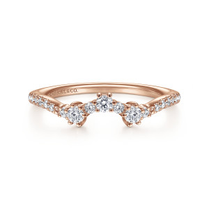 Gabriel & Co. WB14783R4K44JJ 14 karat rose gold Starlight wedding band, front view of a raised arched cluster of prong set rounds flanked by tiny stones