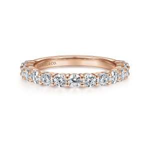 Gabriel & Co. WB14893R8K44JJ 14 karat rose gold Contemporary wedding band, front view of round diamonds framed by bead tipped prongs along a straight hoop with a maker's mark