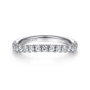 Gabriel & Co. WB14994O8W44JJ 14 karat white gold Contemporary wedding band, front view of larger round diamonds in a single row along a barely bowed top edge