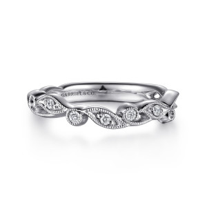 Gabriel & Co. WB15626R4W44JJ 14 karat white gold Floral Nouveau wedding band, front view of curled leaf shapes edged in milgrain holding small round diamonds