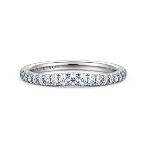 Gabriel & Co. WB16121R8W44JJ 14 karat white gold Contemporary wedding band, front view of the contoured middle where the round diamonds follow a small dip