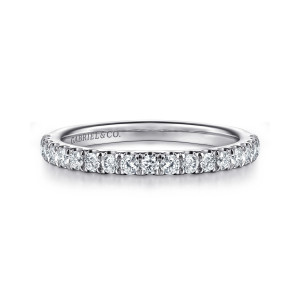 Gabriel & Co. WB16222O12W44JJ 14 karat white gold Contemporary wedding band, front view of small round diamonds in one unbroken line above a smooth rounded inside