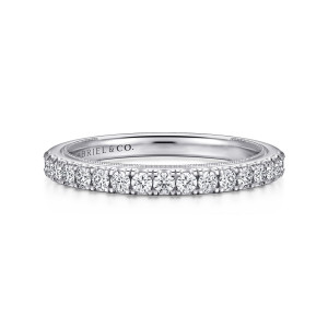 Gabriel & Co. WB16244O8W44JJ 14 karat white gold Contemporary wedding band, front view of a row of round diamonds in shared prongs above a beaded inner edge