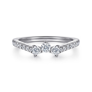 Gabriel & Co. WB16276P6W44JJ 14 karat white gold Classic wedding band, front view of a pointed peak with three larger round diamonds and smaller stones beside them