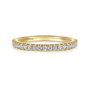 Gabriel & Co. WB16285O6Y44JJ 14 karat yellow gold Classic wedding band, front view of a line of small round diamonds along the top of a plain hoop