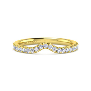 Gabriel & Co. WB16338E6Y44JJ 14 karat yellow gold Contemporary wedding band, front view of a narrow rounded bend in the middle with round diamonds following its edge