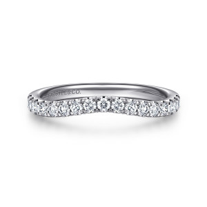 Gabriel & Co. WB16402O6W44JJ 14 karat white gold Contemporary wedding band, front view of the row dipping toward the middle with prongs between each stone