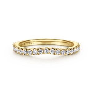 Gabriel & Co. WB16435O6Y44JJ 14 karat yellow gold Contemporary wedding band, front view of the shallow dip in the top edge with prong set round diamonds