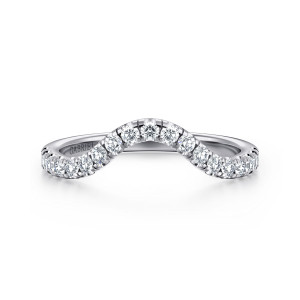 Gabriel & Co. WB16437O12W44JJ 14 karat white gold Contemporary wedding band, front view of a smooth arch rising at the center with round stones following its curve