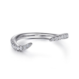 Gabriel & Co. WB16499O6W44JJ 14 karat white gold Contemporary wedding band, angled view of the open gap with tapering tips edged in small round diamonds