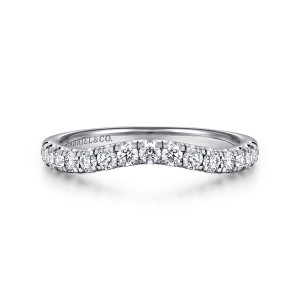 Gabriel & Co. WB16507O10W44JJ 14 karat white gold Contemporary wedding band, front view of the gentle scoop in the top edge with round diamonds between shared prongs