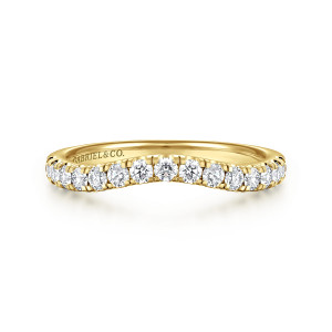 Gabriel & Co. WB16507O10Y44JJ 14 karat yellow gold Contemporary wedding band, front view of a curved row of round diamonds with a maker's mark on the inside