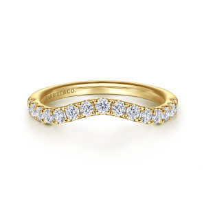 Gabriel & Co. WB16508O8Y44JJ 14 karat yellow gold Contemporary wedding band, front view of round stones in small claws following the soft dip in the top edge