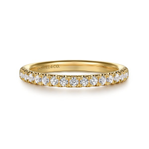 Gabriel & Co. WB16528R8Y44JJ 14 karat yellow gold Contemporary wedding band, front view of round diamonds between paired prongs along a level top edge