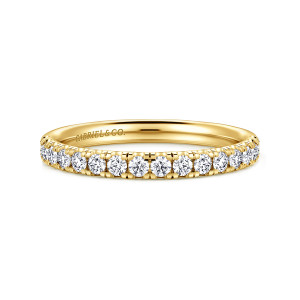 Gabriel & Co. WB16568R8Y44JJ 14 karat yellow gold Contemporary wedding band, front view of a level band with round diamonds lined up in small prongs