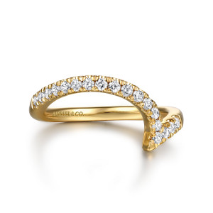 Gabriel & Co. WB16640P8Y44JJ 14 karat yellow gold Contemporary wedding band, top view of a tall arch lined with small round stones, one end narrowing to a point