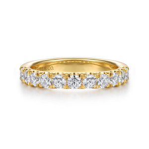 Gabriel & Co. WB16697G20Y44JJ 14 karat yellow gold Contemporary wedding band, front view of round stones held by pointed prongs along the top edge