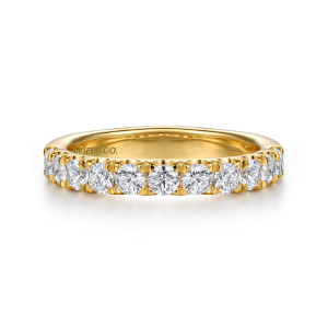 Gabriel & Co. WB16697O8Y44JJ 14 karat yellow gold Contemporary wedding band, front view of a straight band with a line of round stones and pointed prongs between each pair