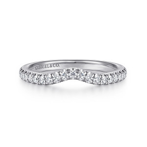 Gabriel & Co. WB16712R4W44JJ 14 karat white gold Contemporary wedding band, front view of a contoured band with a shallow V-shaped dip and a row of round stones