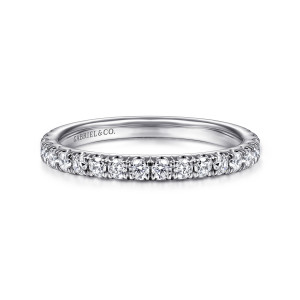 Gabriel & Co. WB16737R8W44JJ 14 karat white gold Contemporary wedding band, front view of round stones lined up along a level edge between pointed prong tips