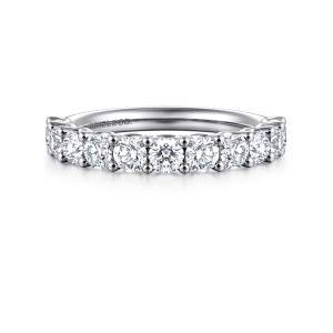 Gabriel & Co. WB16765R8W44JJ 14 karat white gold Contemporary wedding band, front view of large round diamonds gripped by round tipped prongs in a straight row