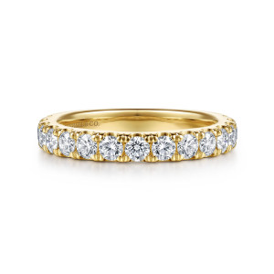 Gabriel & Co. WB16899R12Y44JJ 14 karat yellow gold Classic wedding band, front view of a straight band carrying one line of round diamonds separated by shared claws