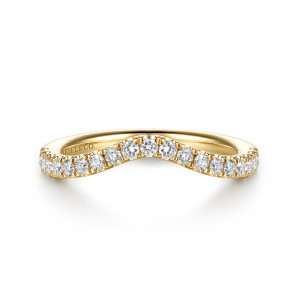 Gabriel & Co. WB16969E12Y44JJ 14 karat yellow gold Classic wedding band, front view of the curved top edge with round diamonds following its shallow arch