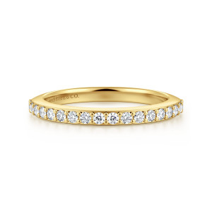 Gabriel & Co. WB16998O8Y44JJ 14 karat yellow gold Classic wedding band, front view of round diamonds divided by small round prongs along the upper edge of the hoop