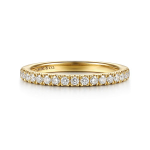 Gabriel & Co. WB17366O8Y44JJ 14 karat yellow gold Classic wedding band, front view of a straight hoop with an even row of round stones between shared prongs