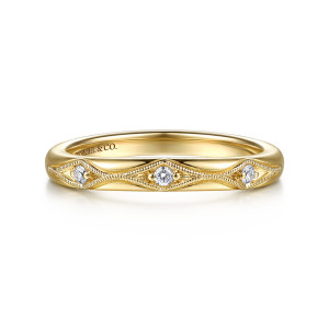 Gabriel & Co. WB17370G12Y44JJ 14 karat yellow gold Victorian wedding band, front view of a smooth band with round diamonds spaced apart in pointed milgrain frames