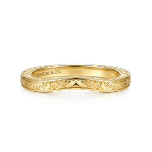 Gabriel & Co. WB17376O10Y4JJJ 14 karat yellow gold Victorian wedding band, front view of engraved scrolls beneath a soft V dip and a fine raised rim
