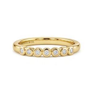 Gabriel & Co. WB17392O8Y44JJ 14 karat yellow gold Contemporary wedding band, front view of round diamonds in separate bezel cups lined up across the top