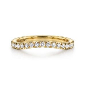 Gabriel & Co. WB17393M6Y44JJ 14 karat yellow gold Classic wedding band, front view of the shallow arch with evenly matched round stones following its curve