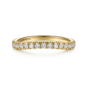 Gabriel & Co. WB17410O8Y44JJ 14 karat yellow gold Classic wedding band, front view of a closely spaced row of small round diamonds dipping gently at the middle