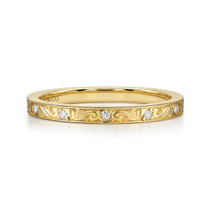 Gabriel & Co. WB17415R8Y44JJ 14 karat yellow gold Victorian wedding band, front view of swirling scrollwork with tiny diamonds set at wide gaps between beaded edges