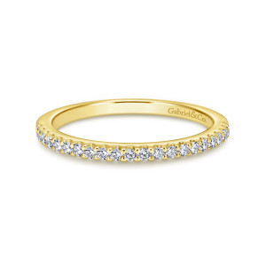 Gabriel & Co. WB6419Y44JJ 14 karat yellow gold Contemporary wedding band, front view of round diamonds in small cups with prong points between neighbors