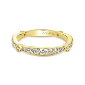 Gabriel & Co. WB6711Y44JJ 14 karat yellow gold Victorian wedding band, front view of a diamond section closed at each end by a single small bezel stone