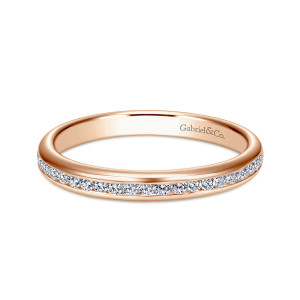 Gabriel & Co. WB7229K44JJ 14 karat rose gold Contemporary wedding band, front view of the channel of small diamonds running along one edge of the band