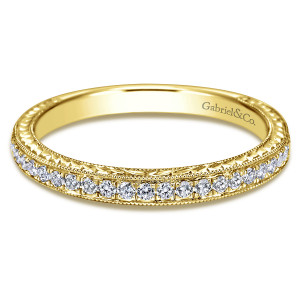 Gabriel & Co. WB7481Y44JJ 14 karat yellow gold Victorian wedding band, front view of the band with engraved sides, beaded borders and a line of round diamonds