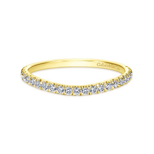 Gabriel & Co. WB8605Y44JJ 14 karat yellow gold Contemporary wedding band, front view of a low curve with a fine row of round stones held by tiny prongs