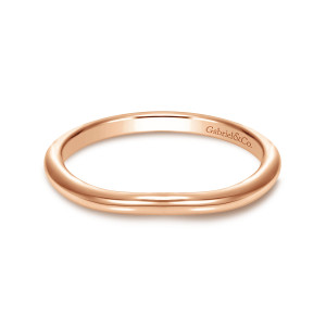 Gabriel & Co. WB9044K4JJJ 14 karat rose gold Contemporary wedding band, front view of a stoneless band with a soft dip along the front and a maker's mark inside
