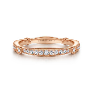 Gabriel & Co. WB96711R8K44JJ 14 karat rose gold Victorian wedding band, front view of a milgrain-edged stone panel flanked by two round bezel settings