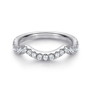 Gabriel & Co. WB9766W44JJ 14 karat white gold Contemporary wedding band, front view of the stone line curving inward in the middle, with a maker's mark inside