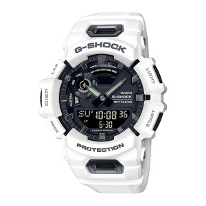 Casio G-Shock Move GBA900-7A watch, front view of the white case with lettered guards, black dial, pale hands and wide lower digital panel