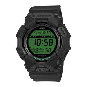 Casio G-Shock GD010BEG-1 watch, front view of a round green screen framed by faceted black guards and green curved lettering