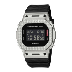 Casio G-Shock G-Steel GM5600M-1 watch, front view of the all silver tone square case with round holes and slots at top and bottom