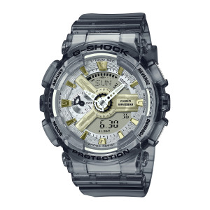 Casio G-Shock GMAS110GS-8A watch, front view of the smoke gray case with gold tone markers and a gear shaped hub