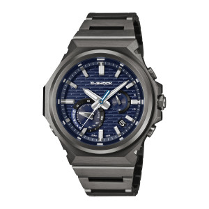 Casio G-Shock G-Steel GSTB1000BD-2A watch, front view of a dark gray faceted case with a ridged blue dial and a slotted link band