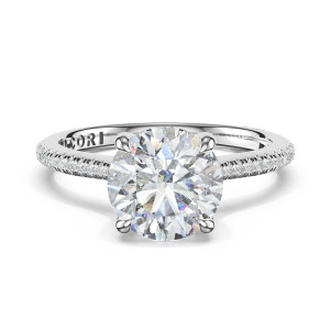 HT2581RD8W top view, round brilliant center on a slender pave band in white metal